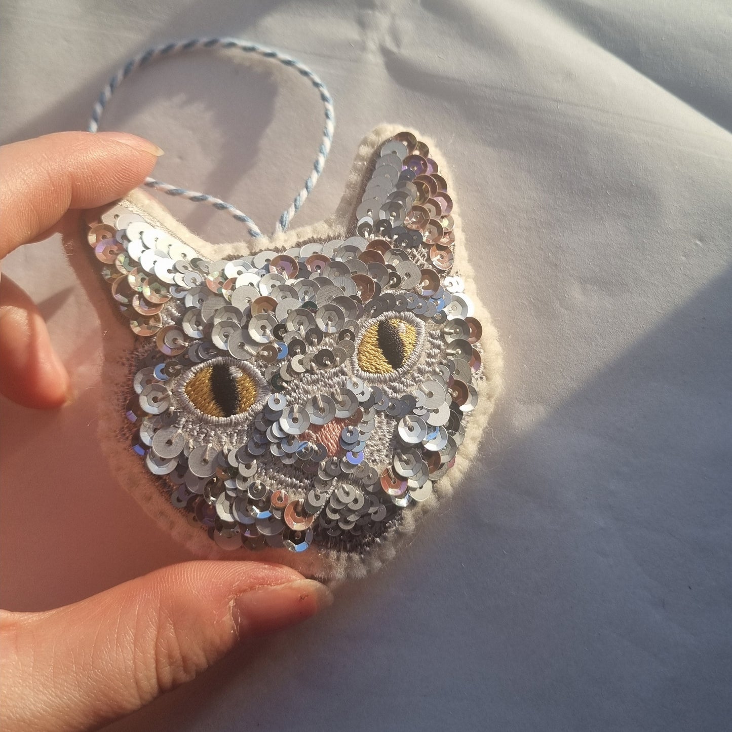Sequined cat ornament