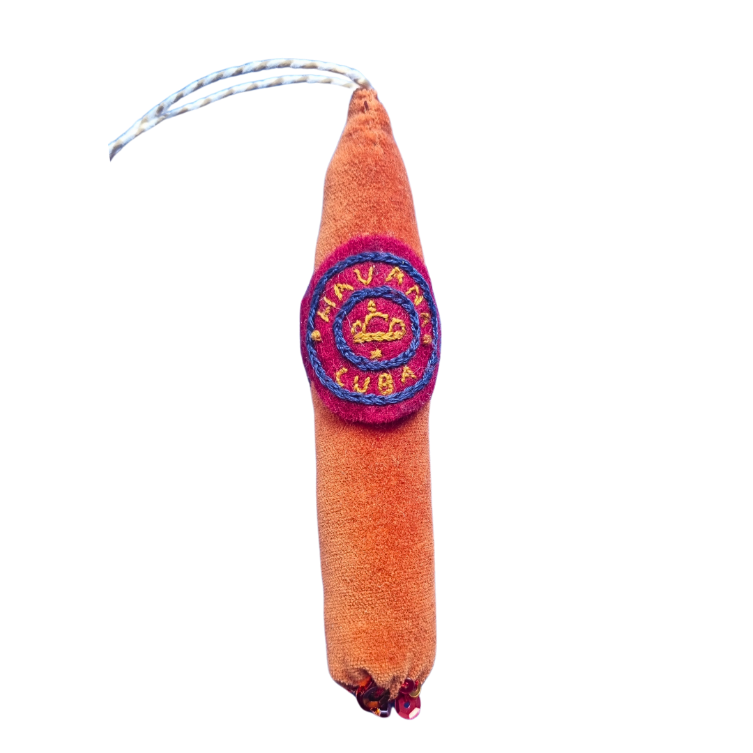 A velvet and sequin cigar ornament cutout
