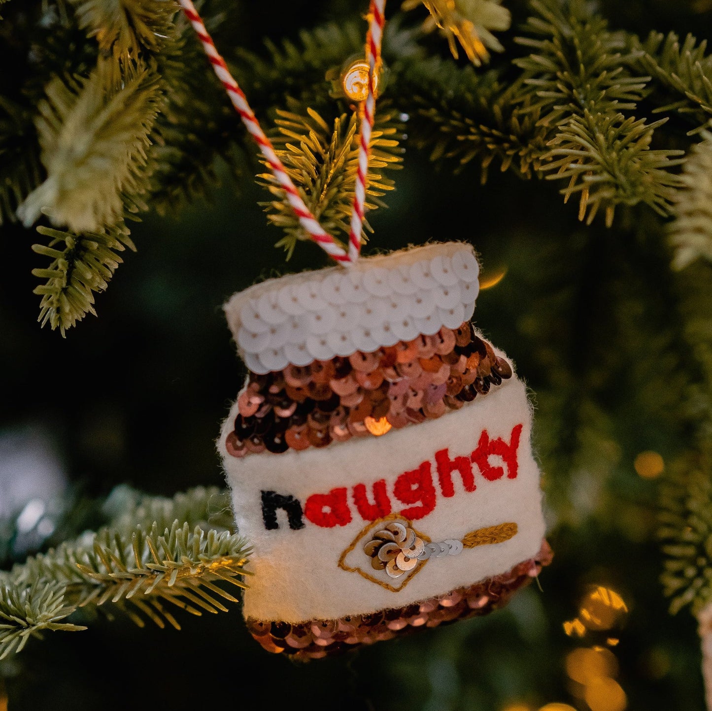 Naughty Chocolates spread jar on a christmas tree