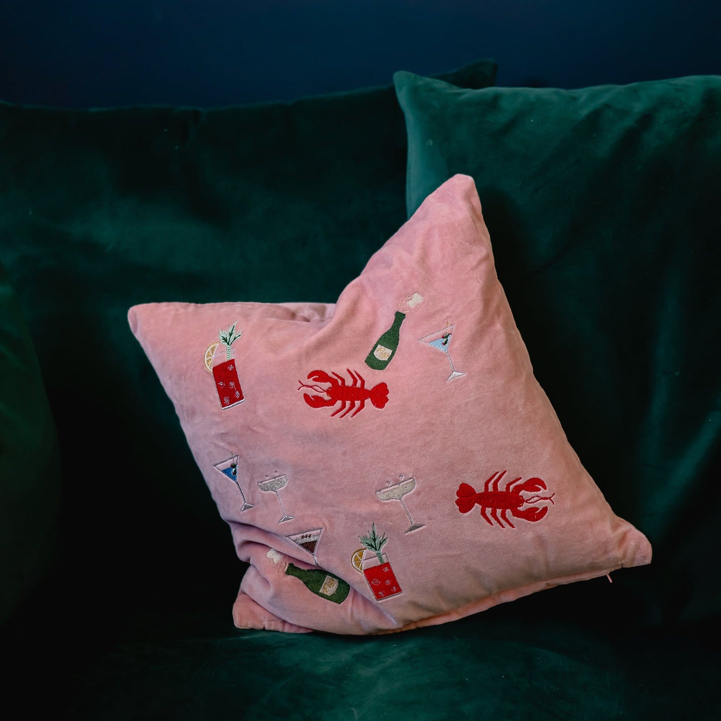 pink velvet doodle cushion with embroidered lobsters and cocktails