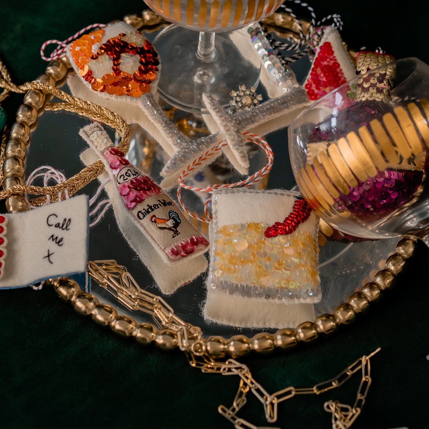 A collection of sequinned ornaments of drinks