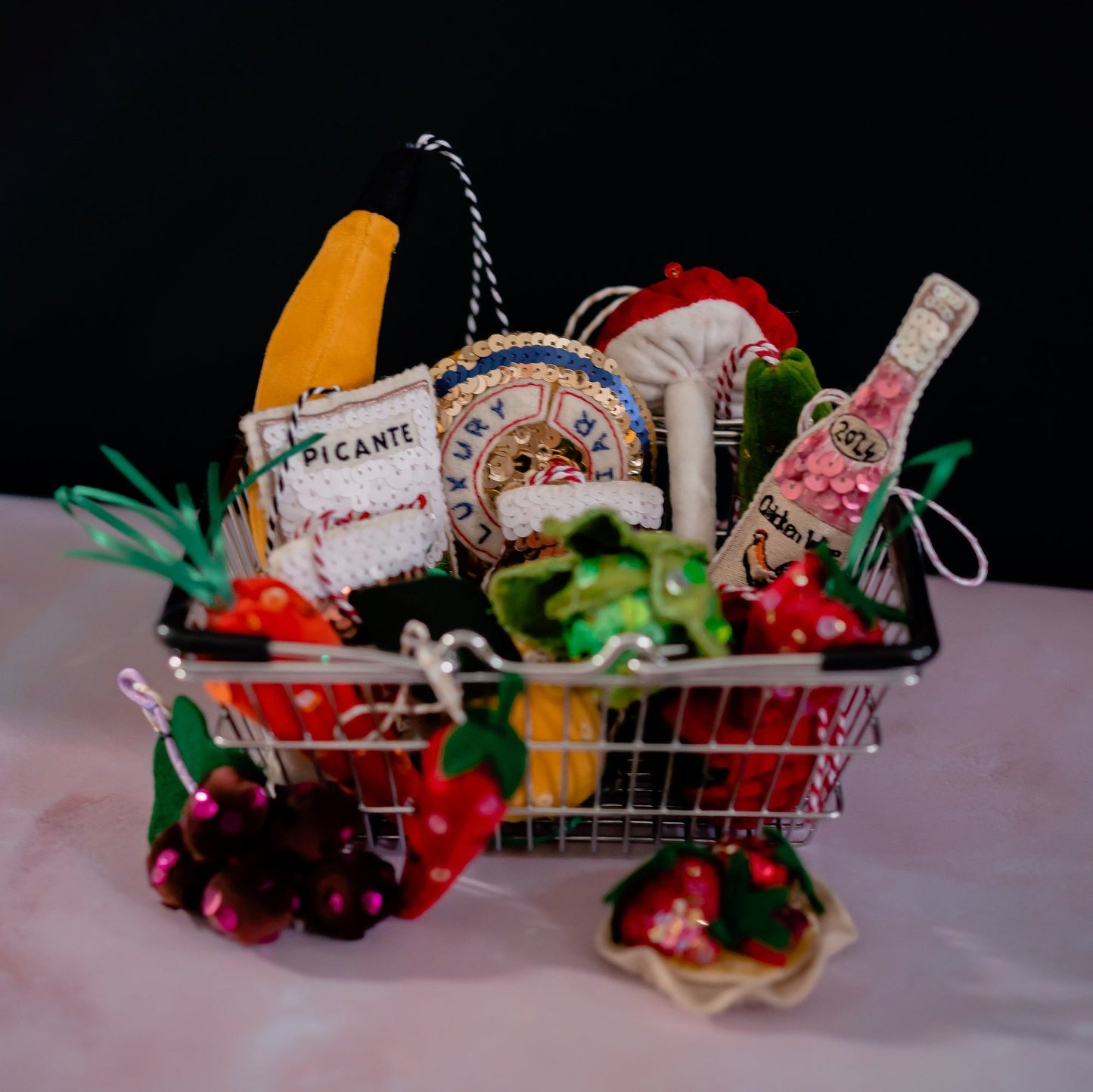 A shopping basket containing sequinned groceries