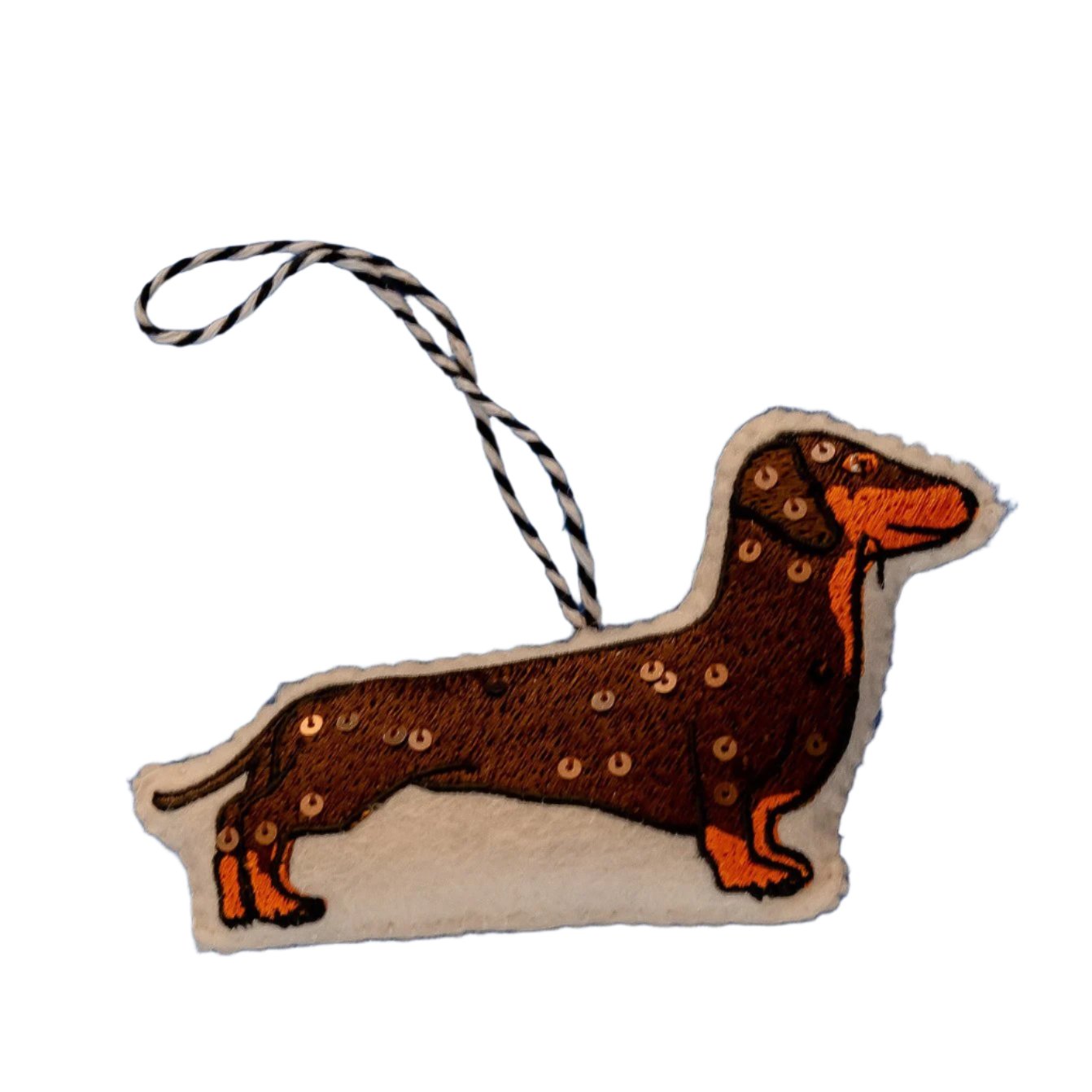 An embroidered sausage dog ornament cutout