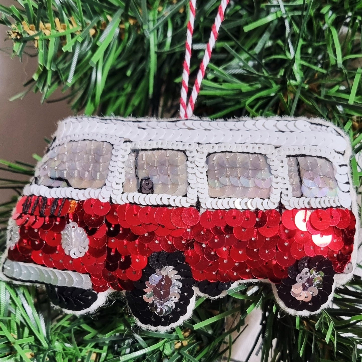 A sequin red retro campervan ornament