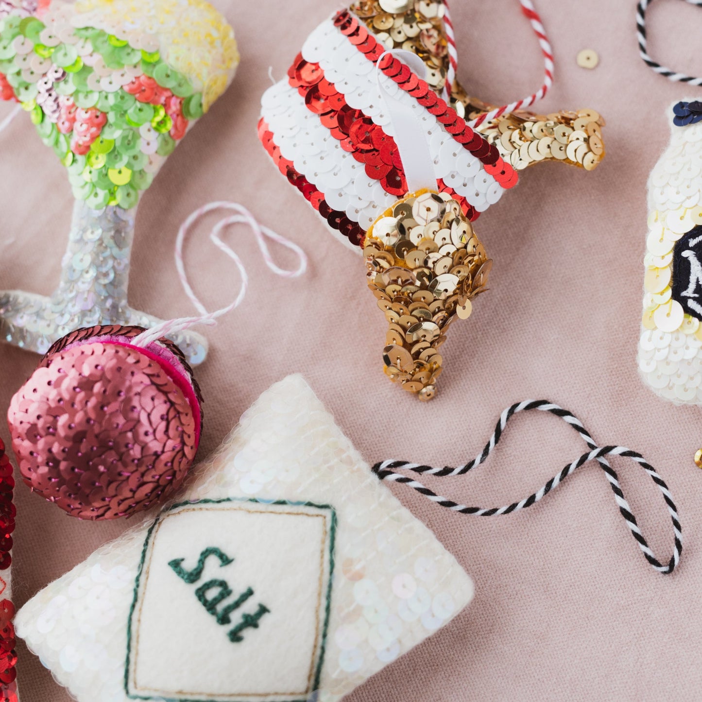 A selection of ornaments including salt, fried chicken, macaron, shrimp cocktail
