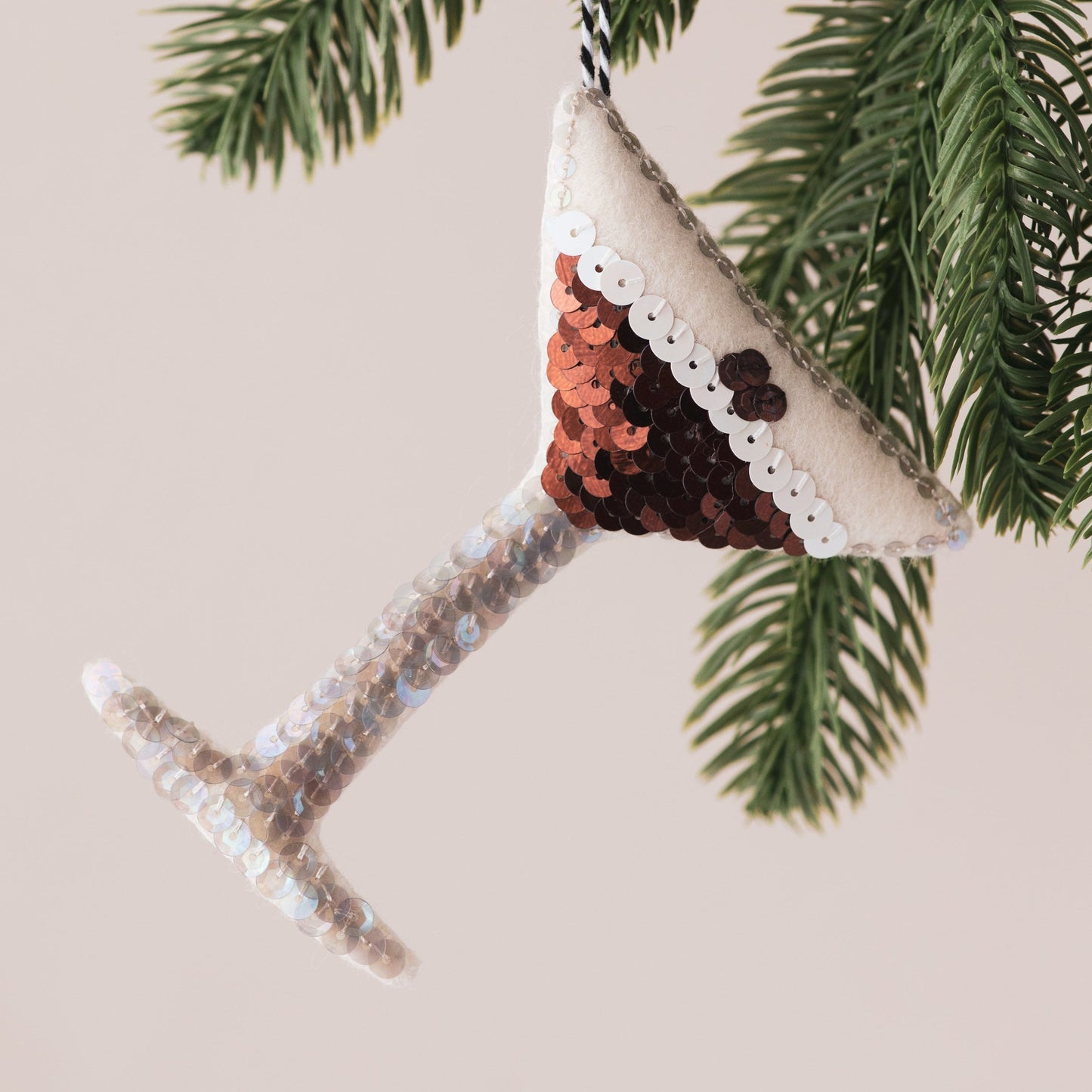 Handmade Espresso Martini Sequin Ornament hanging in a tree
