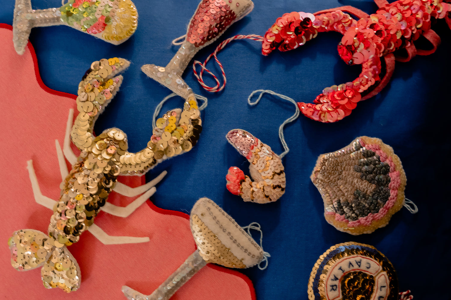 A collection of sequin ornaments on a sea food theme