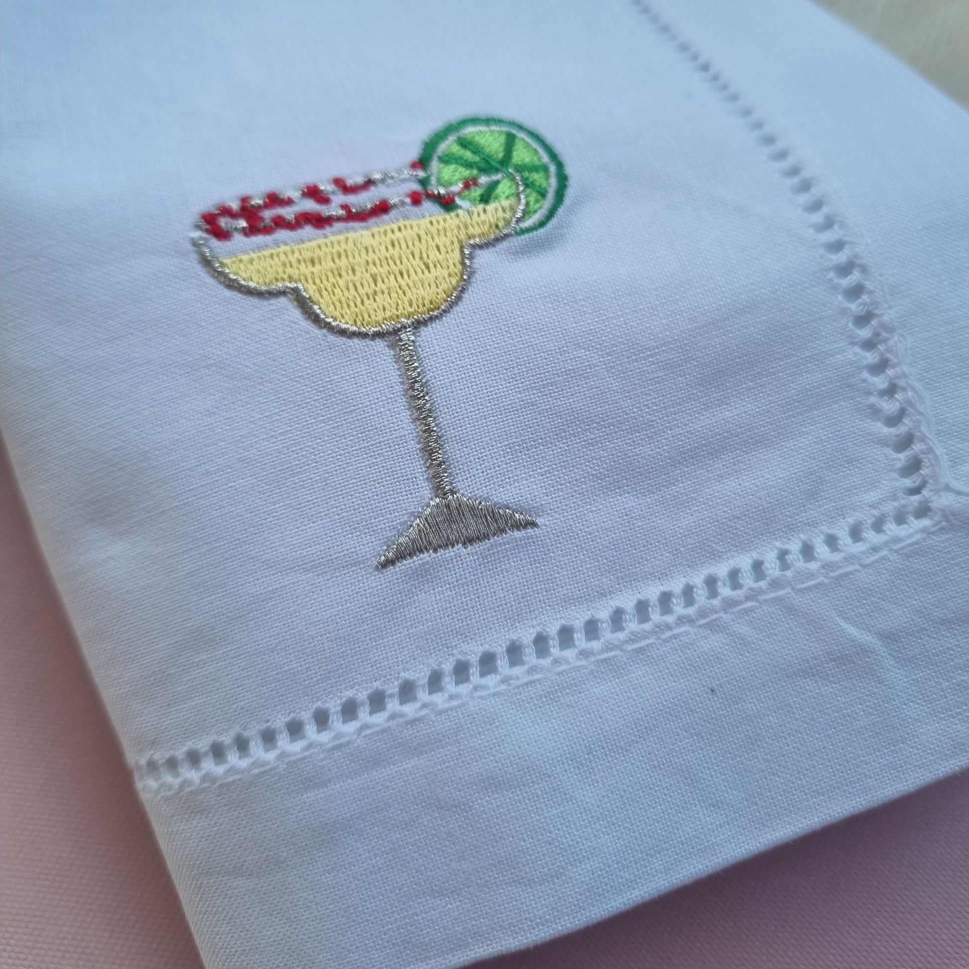 Embroidered margarita cocktail design on a white cotton napkin 