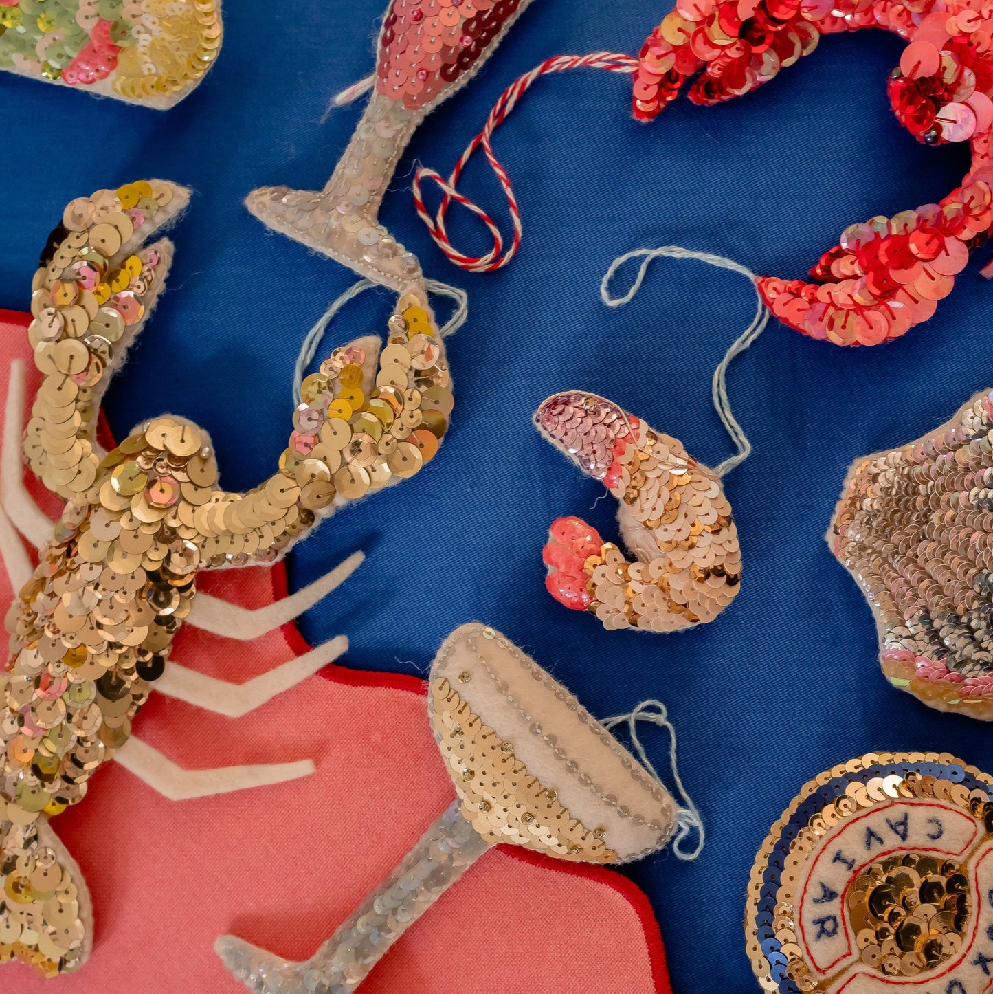 A collection of sequinned sea themed ornaments