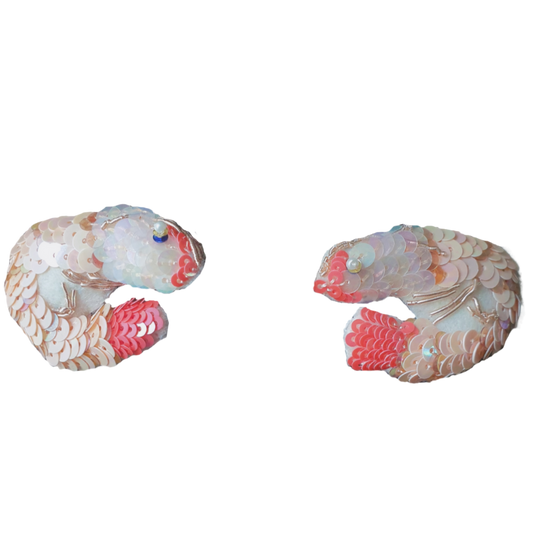 A pair of pale pink sequinned prawns