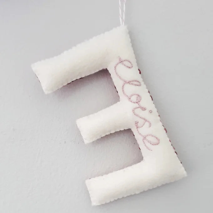 Custom Sequin Letter Hanging Ornament, the reverse with the name Eloise embroidered on the E