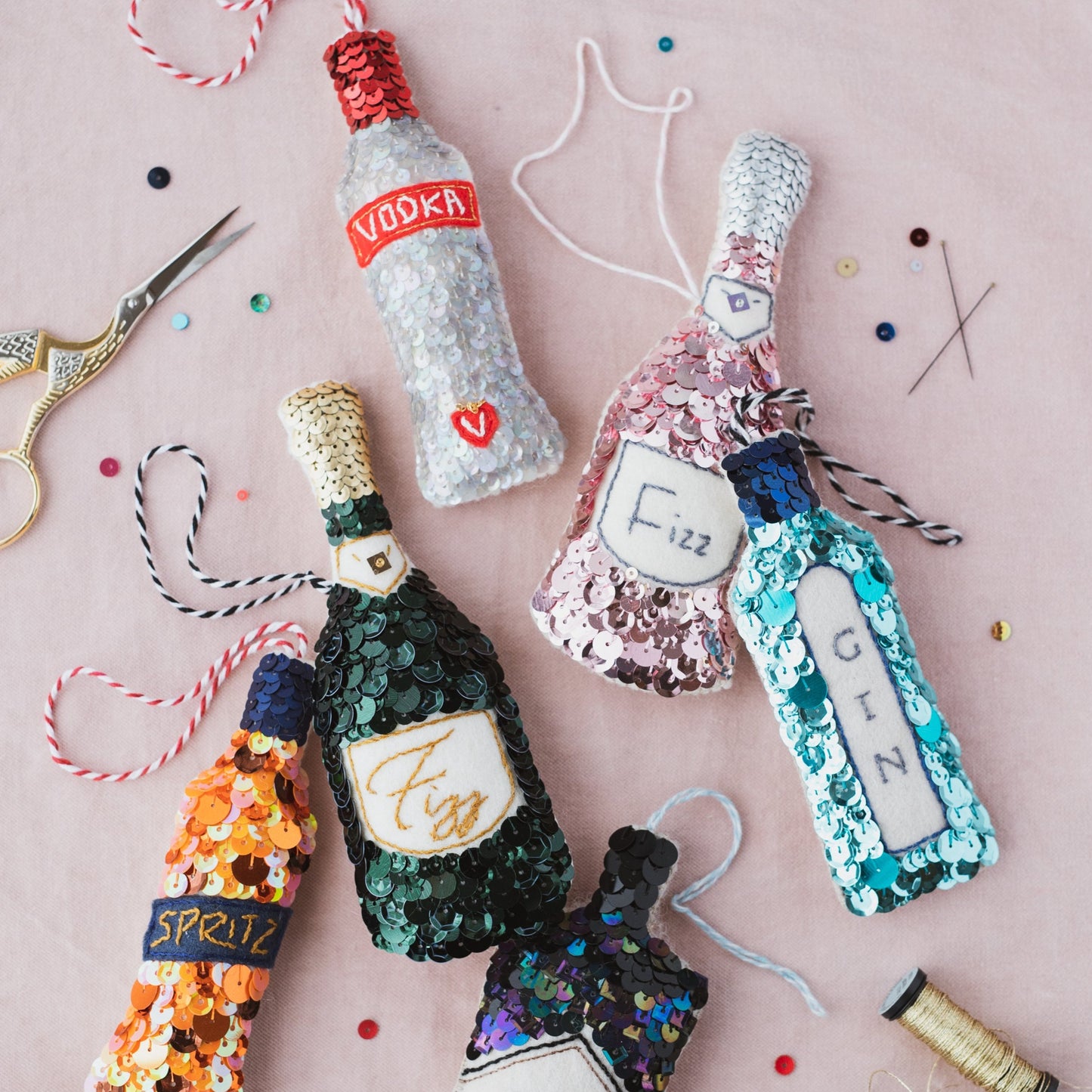a collection of boozy sequin ornaments