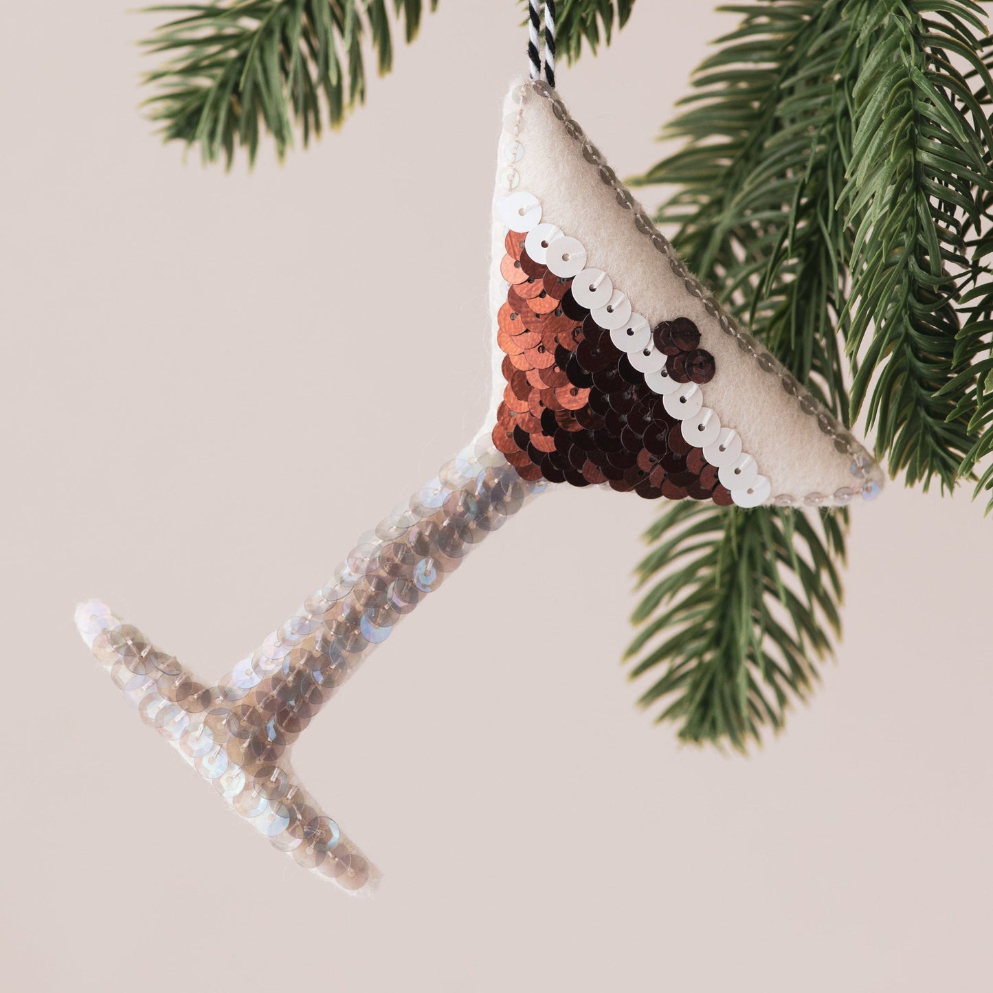 Handmade Espresso Martini Sequin Ornament  hanging in a tree