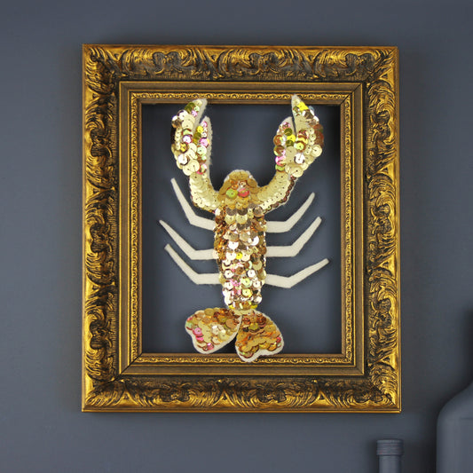 Handmade Lobster Sequin Christmas Ornament, a golden sequin lobster in a gilt carved frame 